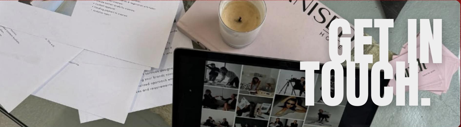 Creative workspace with moodboards and a tablet